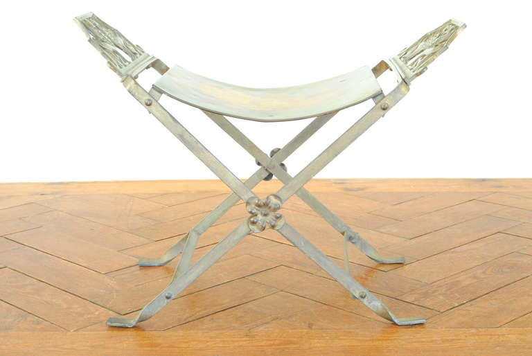 having a concave seat with extending figural castings of griffins, the x-form legs having floral decorations and joined by thin stretchers, the frame resting on twisted and flattened feet

Please go to www.robuck.co to see our complete inventory.