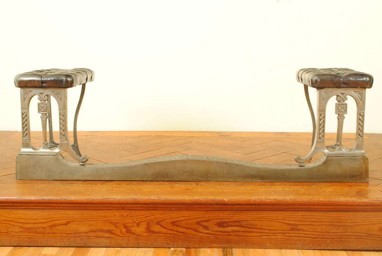 An American Early Arts & Crafts Silvered Brass and Tufted Leather Fire Fender