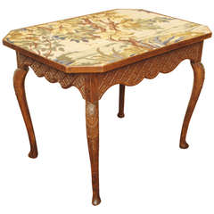 A French Louis XIV/XV Carved Walnut Table with Needlepoint Top