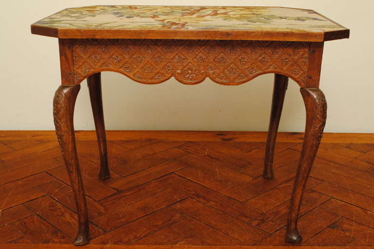 A French Louis XIV/XV Carved Walnut Table with Needlepoint Top