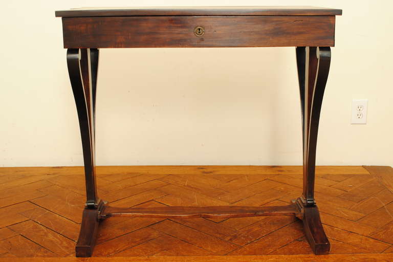 A 19th Century Italian Neoclassic Walnut and Ebonized 1-Drawer Table