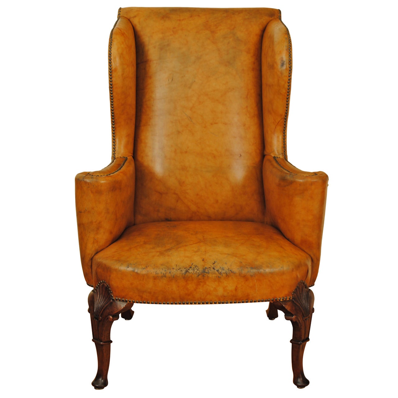 Carved Walnut Georgian Style Leather Upholstered Wing Chair