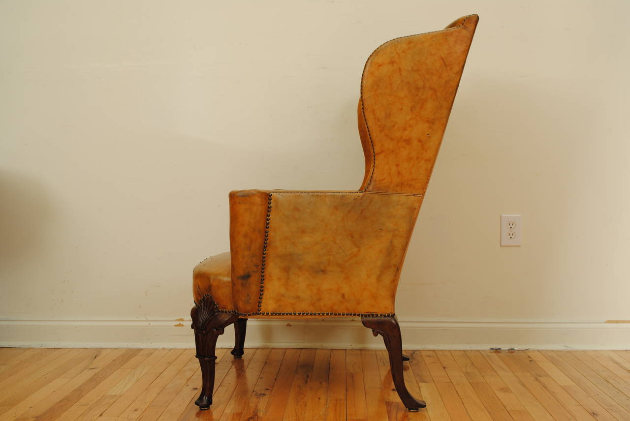 Carved Walnut Georgian Style Leather Upholstered Wing Chair 1