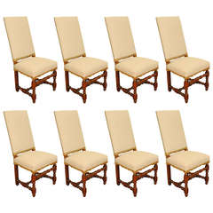 A Set of Eight French LXIII Style Walnut and Upholstered Dining Chairs