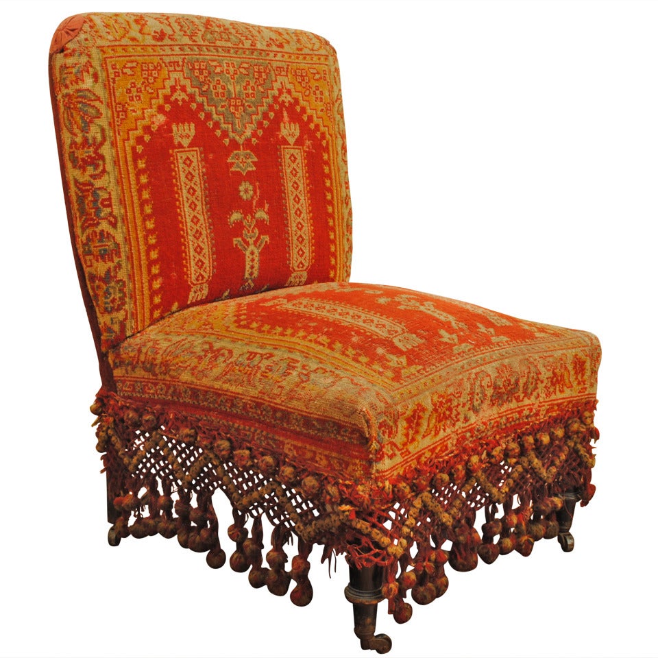 A Louis Philippe Ebonized Walnut and Carpet Upholstered Slipper Chair, La Boheme