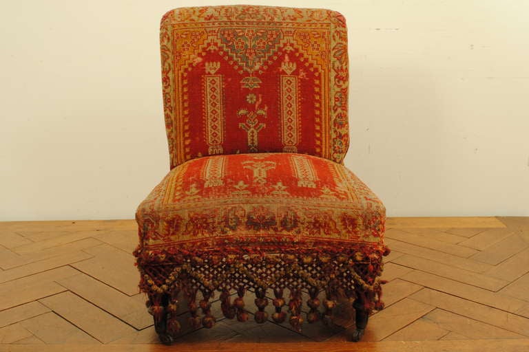 French A Louis Philippe Ebonized Walnut and Carpet Upholstered Slipper Chair, La Boheme