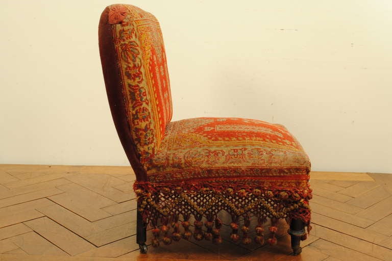 A Louis Philippe Ebonized Walnut and Carpet Upholstered Slipper Chair, La Boheme In Good Condition In Atlanta, GA