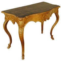 A Florentine Rococo Carved Giltwood and Faux Marble Console Table