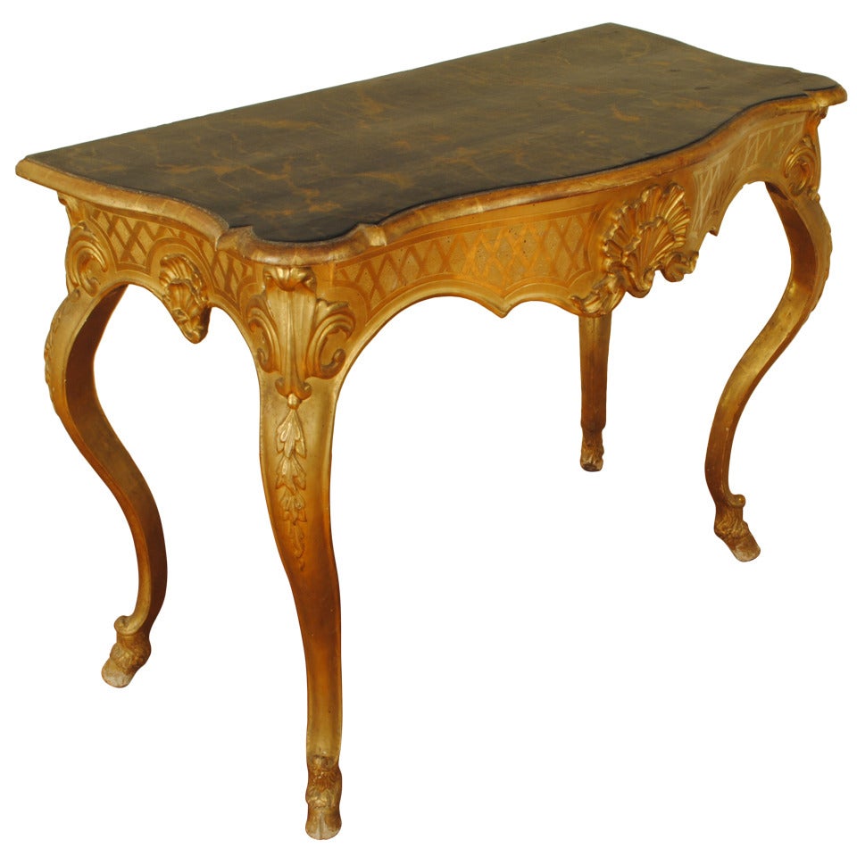 A Florentine Rococo Carved Giltwood and Faux Marble Console Table