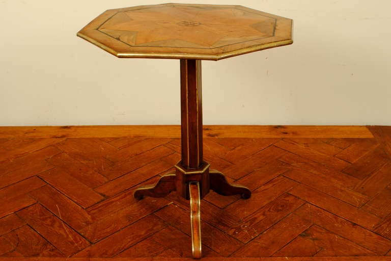 A French Late Neoclassic Octagonal Walnut, Inlaid, & Brass Tilt Top Table