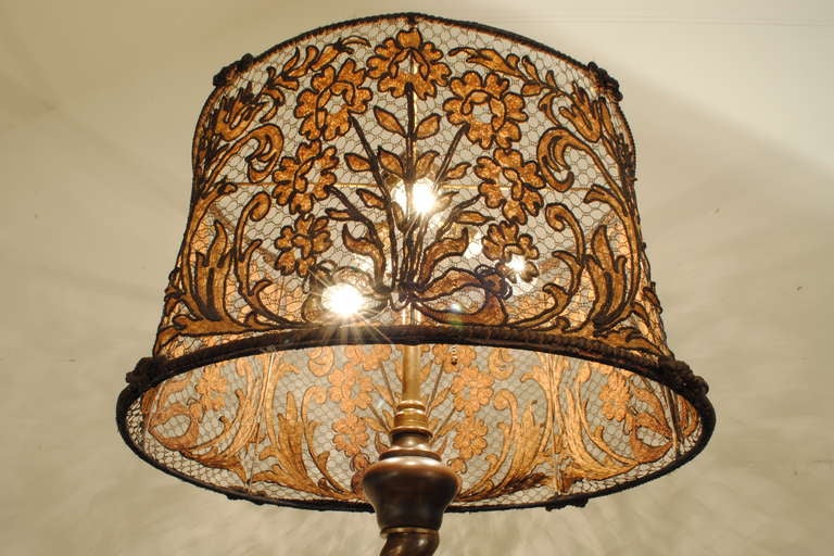 An Italian Baroque Style Cast Brass Floor Lamp with Woven French Lampshade In Excellent Condition In Atlanta, GA