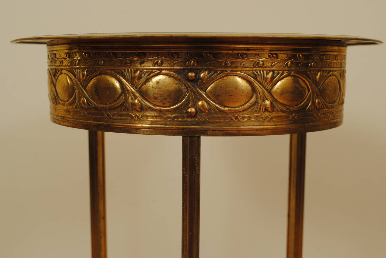 Of Circular and made completely of brass, two-tiered with removal top and hoof feet