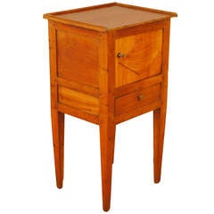 A French Neoclassic Early 19th Century Light Walnut Commode