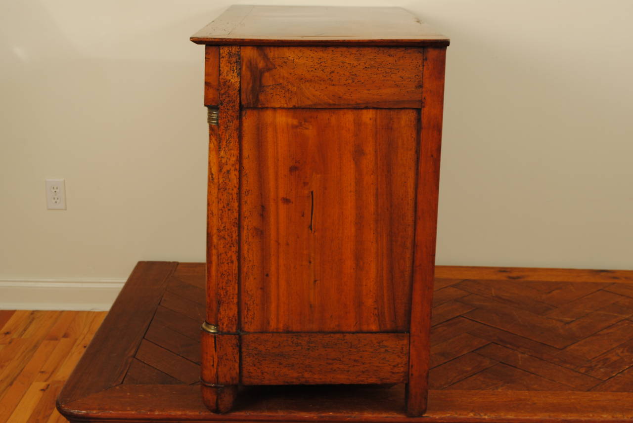 French Restauration Period Walnut Four-Drawer Commode, Brass Hardware In Good Condition In Atlanta, GA