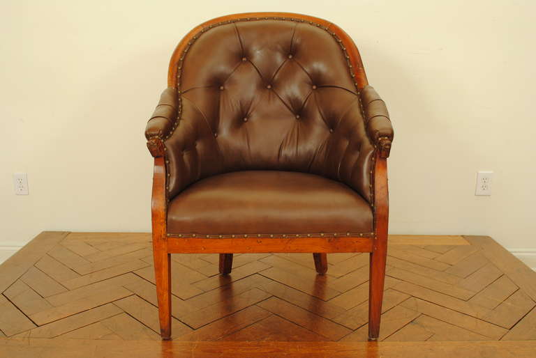 with concave back, solid fruitwood frame, upholstered in tufted leather