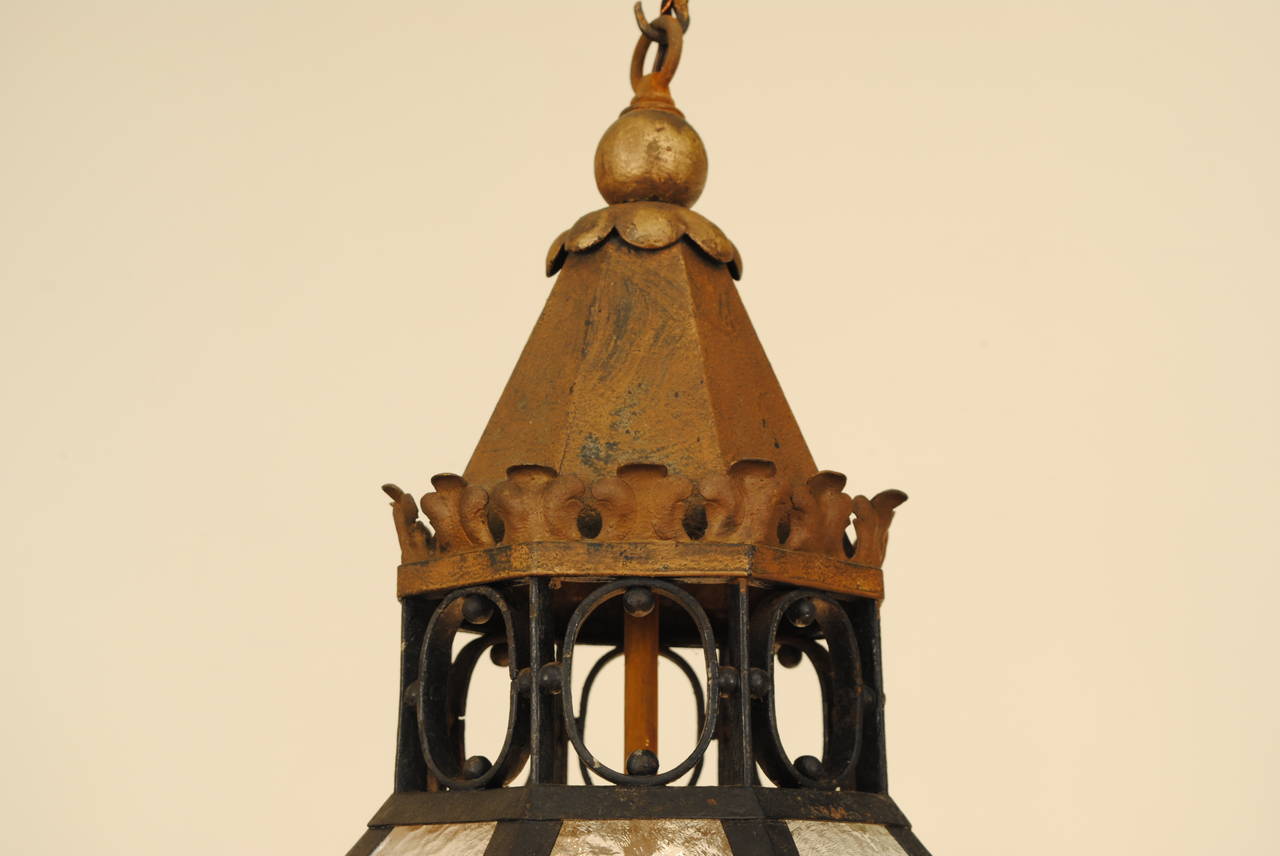 Having a gilt metal conic top above gilt metal plumes and oval shaped iron details, the lantern of octagonal form with many panes of glass, the main body with gilt metal swags and a hinged door, gilt metal rosettes and small bun 