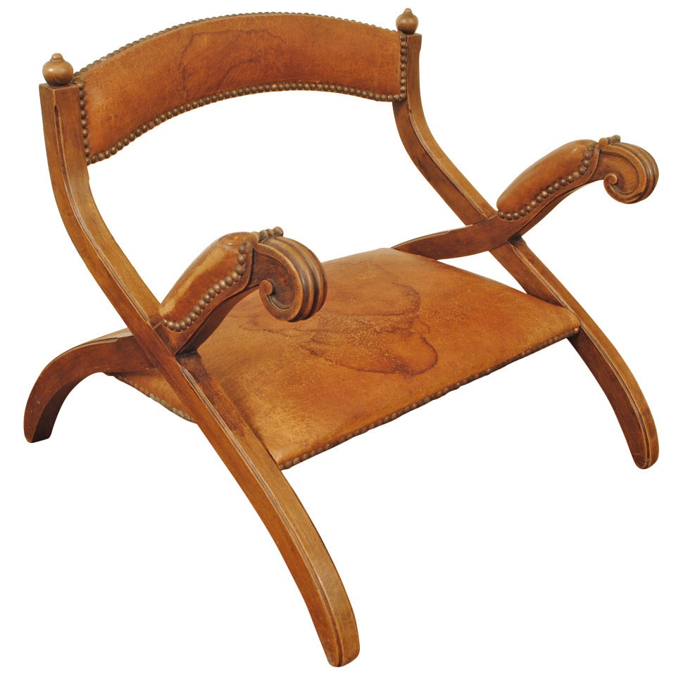 A Portuguese Low Mahogany and Leather Upholstered "Saddle Chair"