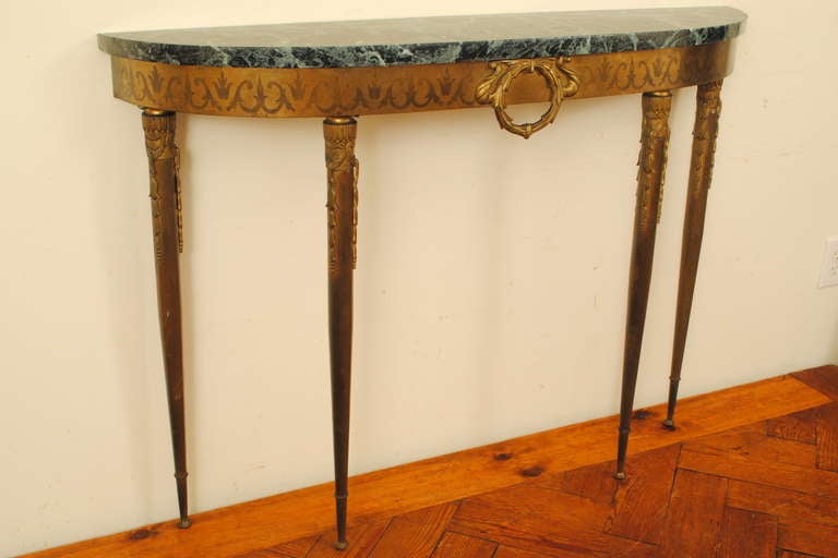 having beautifully cast detail along legs and etching along upper gallery with center wreath, green marble top

Please go to www.robuck.co to see our complete inventory.