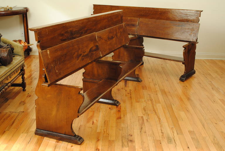 the slightly leaning backrest with an upper molding above a hinged seat raising to reveal a kneeling area, supported by three identical shaped trestles on elongated bracket feet.

kneeling height is 12 inches