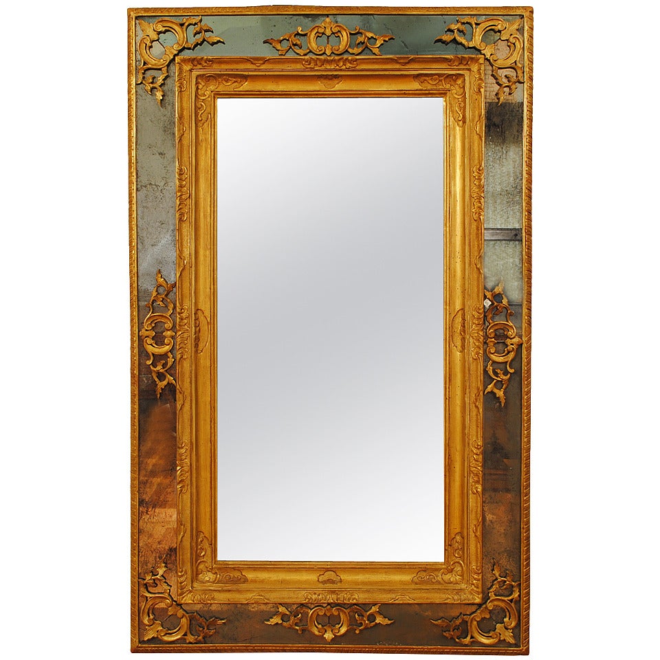 Italian Regence Period Carved Giltwood and Embossed Gilt Gesso Mirror