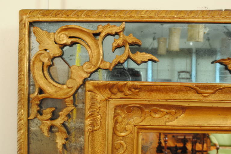 Italian Regence Period Carved Giltwood and Embossed Gilt Gesso Mirror In Excellent Condition In Atlanta, GA