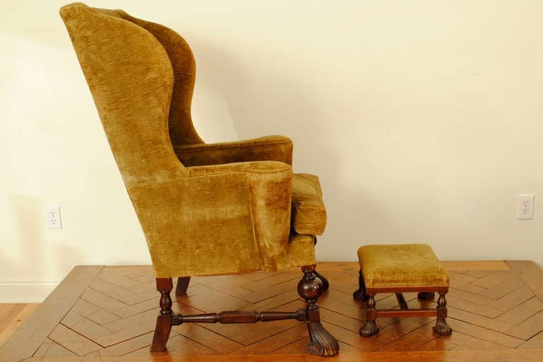 An Italian Walnut and Velvet Upholstered Wingback Chair with Ottoman In Excellent Condition In Atlanta, GA