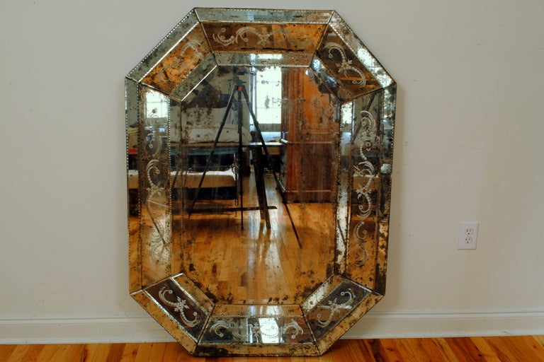 An Antique Glass Elongated Octagonal Etched and Bevelled Venetian Mirror