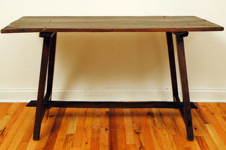 A Spanish Baroque Walnut and Pinewood Trestle Form Table/Console