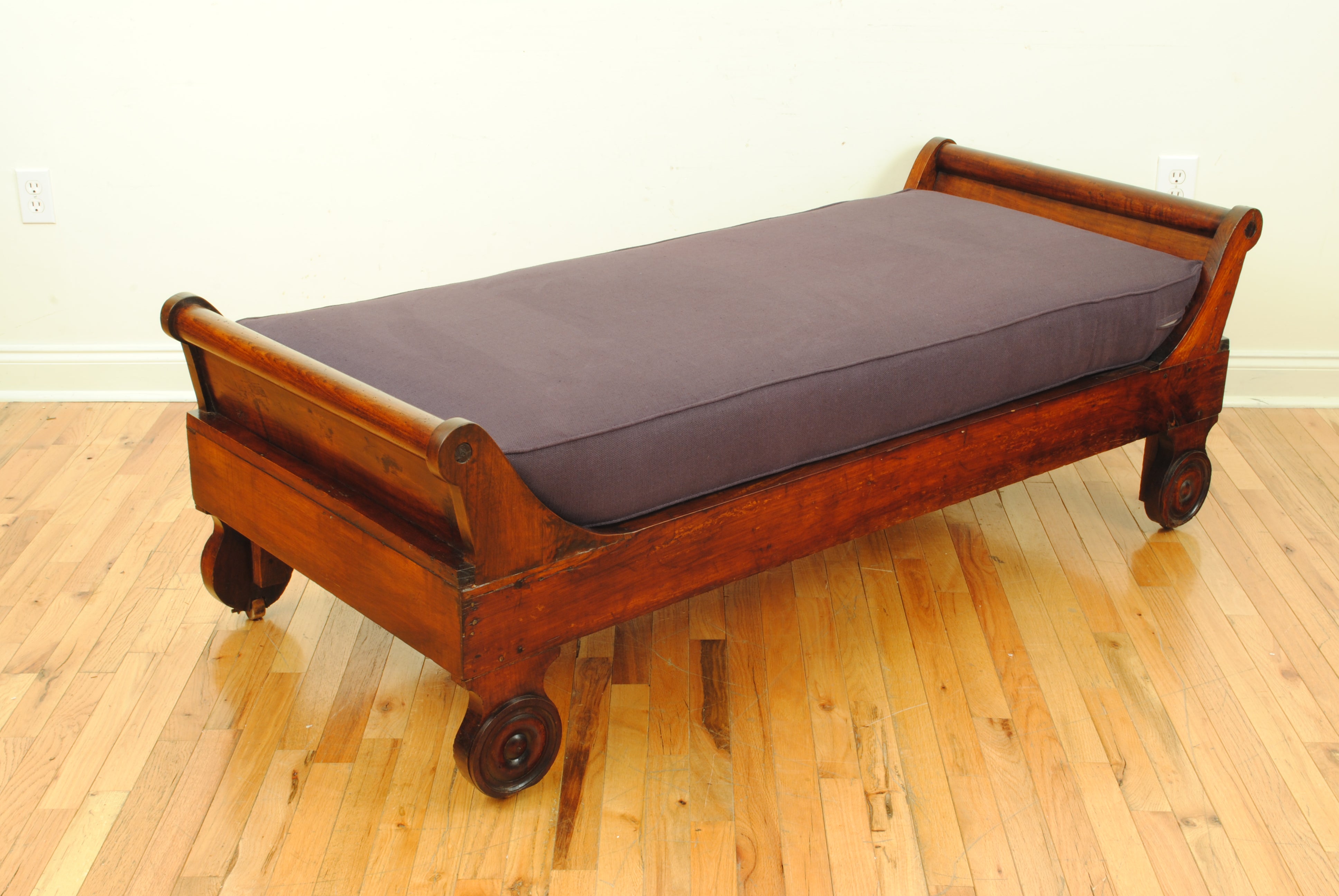 A French 2nd quarter 19th century Louis Philippe Carved Mahogany Daybed