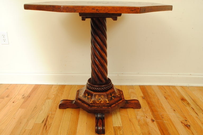 An Early 18th Century Austrian Elmwood and Inlaid Tilt Top Center or Games Table