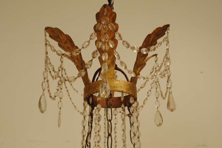 An Italian Empire Period, early 19th Century, 18-Light Gilt Gesso, Iron, and Glass Chandelier