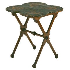 An Italian Arts and Crafts Style X-form Tooled Leather Top Table