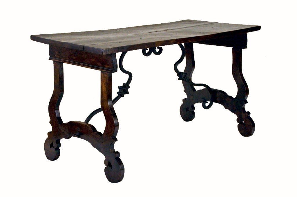 An Italian Baroque Style Walnut and Iron Stretcher Table