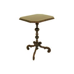 A Lombardy Rococo Revival Dark Walnut and Inlaid Pedestal Table