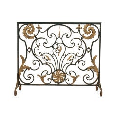 A French Rococo Style Wrought Iron and Gilt Metal Firescreen