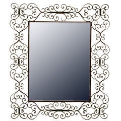 A Large Spanish Wrought Iron Mirror A Large Spanish Wrought Iron Mirror