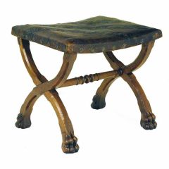 A Spanish Baroque Style Carved Walnut Bench, Tooled Leather Top