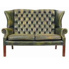 An English Mahogany and Leather Upholstered Sofa