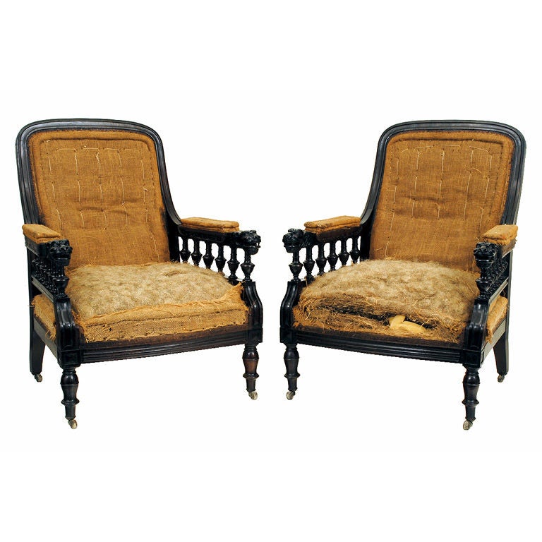A Pair of English Carved Mahogany and Walnut Victorian Armchairs
