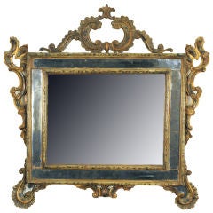 A Venitian Rococo Lacquered and Giltwood Looking Glass