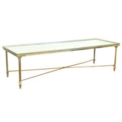 A French "Jansen" Cast Brass and Mirrored Coffee Table