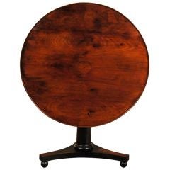 A French Restauration Period Walnut & Ebonized Tilt Top Table