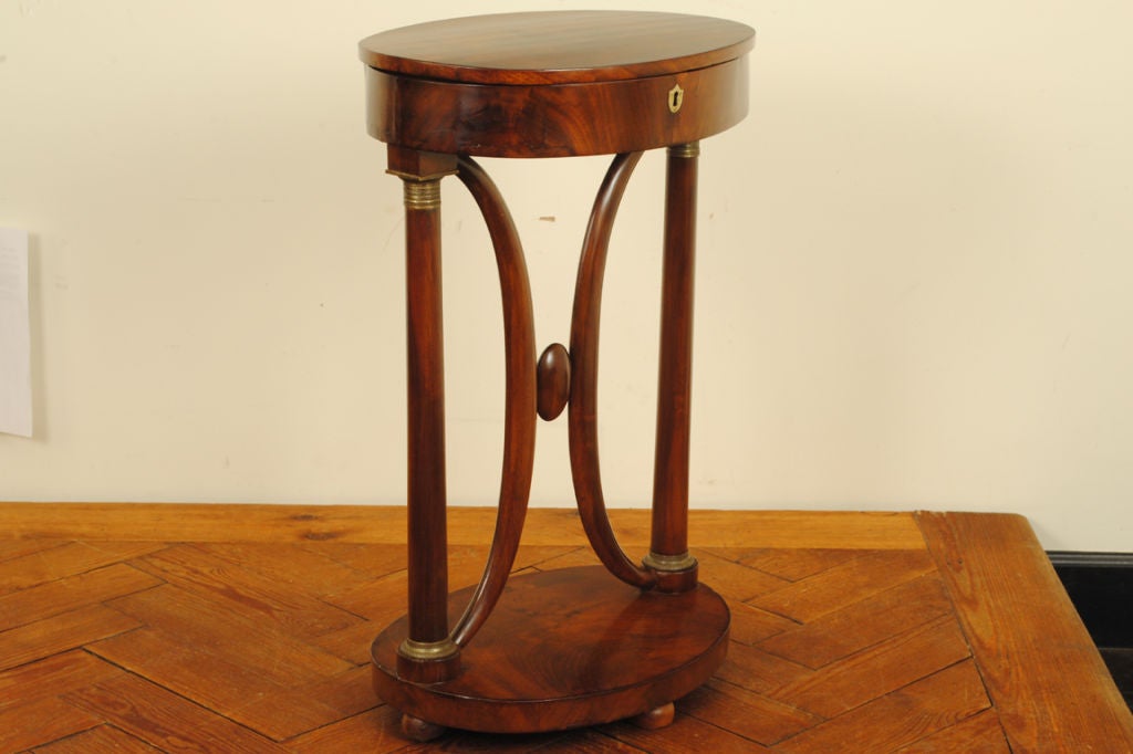 A Biedermeier Mahogany Walnut Sewing Table