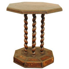 A French Arts and Crafts Leather Uphostered and Walnut Table