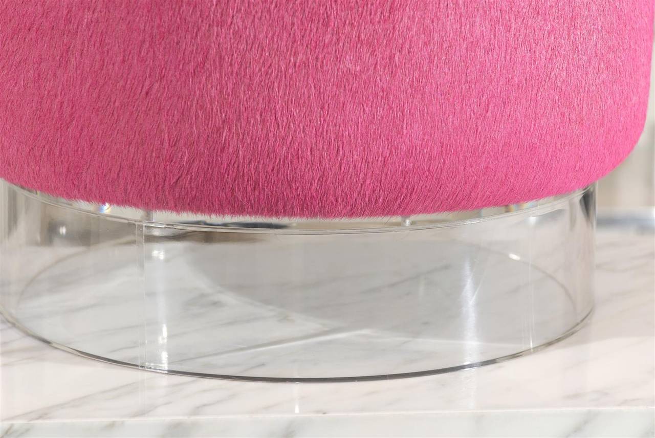 * Round stool upholstered in pink cowhide
* Lucite base
* Very sturdy 
* Inquire for more finishes