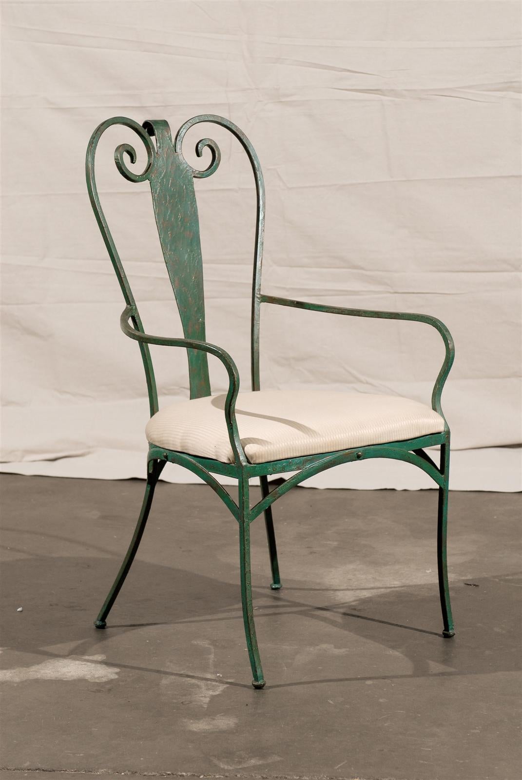 Set of four 20th century French painted iron chairs.
Elegant, comfortable garden chairs