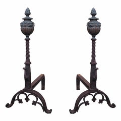 Pair of Large Continental Iron and Bronze Andirons with Faces on Finial