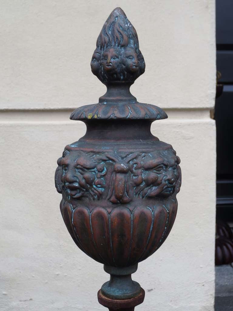 Pair of Large Continental Iron and Bronze Andirons with Faces on Finial In Good Condition For Sale In Atlanta, GA