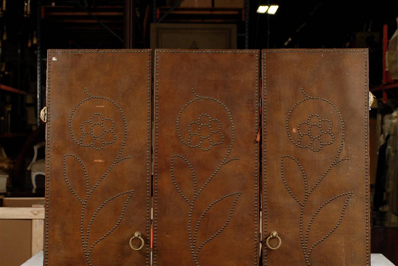 Set of three 20th century leather doors with brass studs
Measures: Each 22.25