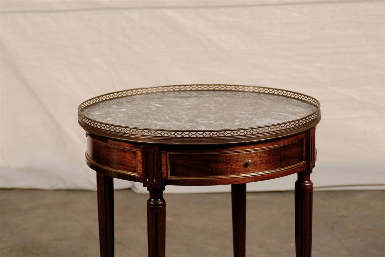 20th century gray marble bouillotte table.